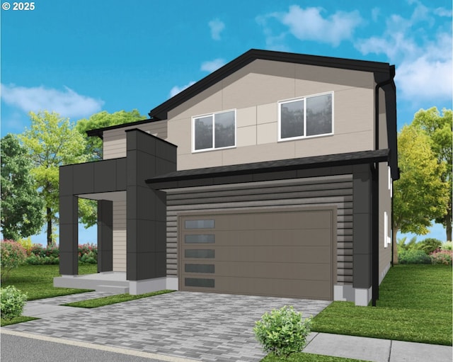 contemporary home with decorative driveway, an attached garage, a front yard, and stucco siding