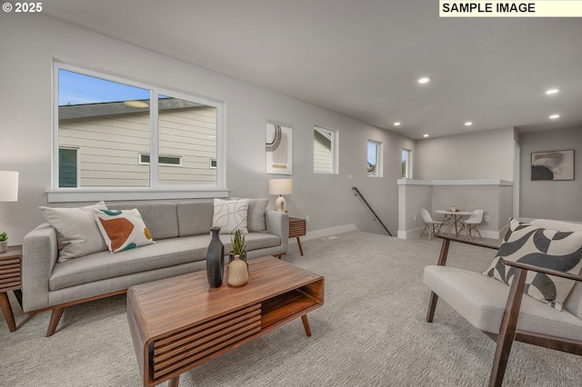 living room featuring plenty of natural light, recessed lighting, and carpet floors