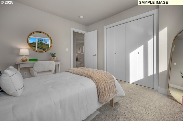 bedroom with a closet and light colored carpet