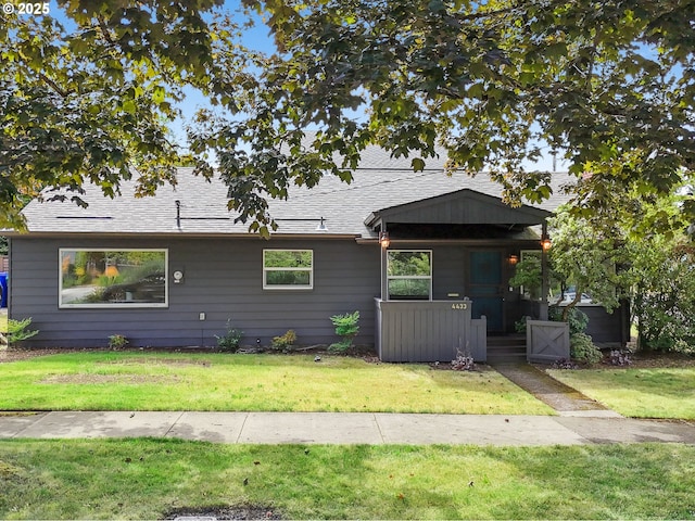 4433 NE 65th Ave, Portland, OR 97218 - view of front of house featuring a front yard and roof with shingles
