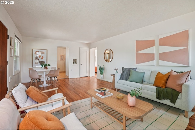 4433 NE 65th Ave, Portland, OR 97218 - living room with light wood-style floors and a textured ceiling