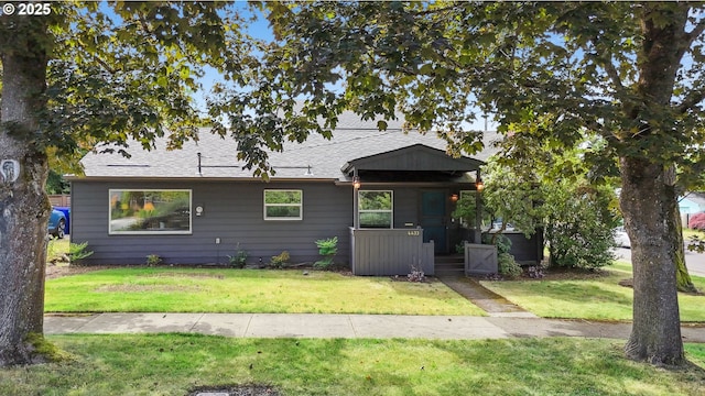 4433 NE 65th Ave, Portland, OR 97218 - view of front facade with a front yard and a shingled roof