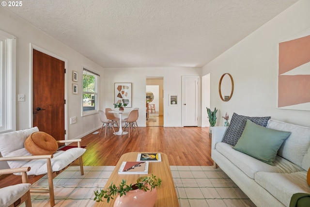 4433 NE 65th Ave, Portland, OR 97218 - living area with light wood-style floors and a textured ceiling