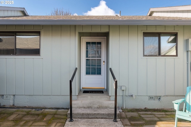 entrance to property with crawl space and roof with shingles