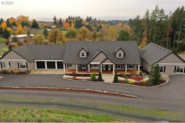 view of front facade featuring aphalt driveway and an attached garage