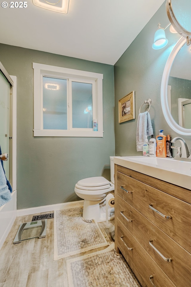 1445 NE 17th St, Gresham, OR 97030 - bathroom with vanity, wood finished floors, and shower / bath combination with glass door