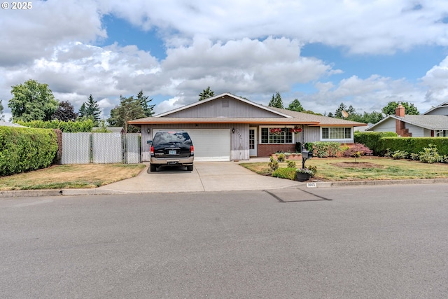 1445 NE 17th St, Gresham, OR 97030 - ranch-style house with concrete driveway, a garage, brick siding, and board and batten siding