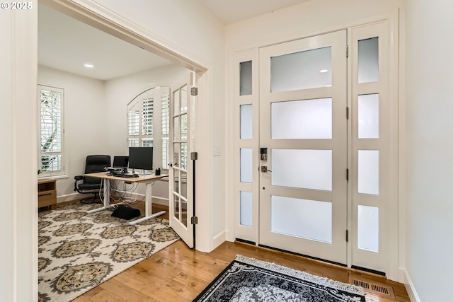 18350 SW Florendo Ln, Beaverton, OR 97007 - foyer with baseboards and wood finished floors