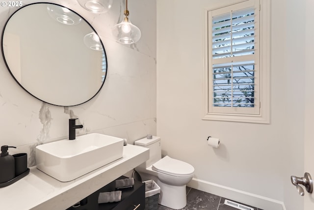 18350 SW Florendo Ln, Beaverton, OR 97007 - bathroom featuring visible vents, baseboards, a sink, toilet, and tile patterned flooring