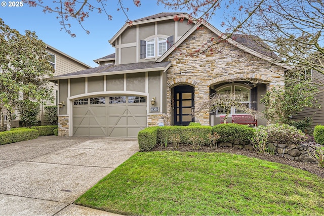 18350 SW Florendo Ln, Beaverton, OR 97007 - craftsman-style house with concrete driveway, stucco siding, stone siding, and an attached garage