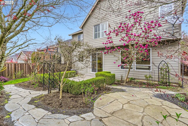 18350 SW Florendo Ln, Beaverton, OR 97007 - view of front of home featuring fence and a patio
