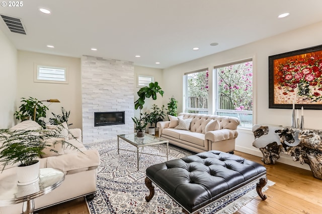 18350 SW Florendo Ln, Beaverton, OR 97007 - living area with visible vents, a wealth of natural light, recessed lighting, and wood finished floors