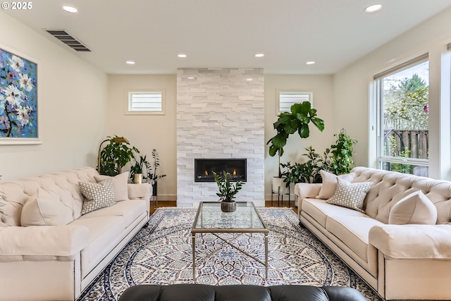 18350 SW Florendo Ln, Beaverton, OR 97007 - living room featuring recessed lighting, visible vents, a large fireplace, and wood finished floors