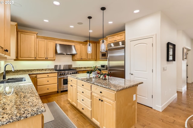18350 SW Florendo Ln, Beaverton, OR 97007 - kitchen featuring light brown cabinetry, a sink, built in appliances, and wall chimney exhaust hood