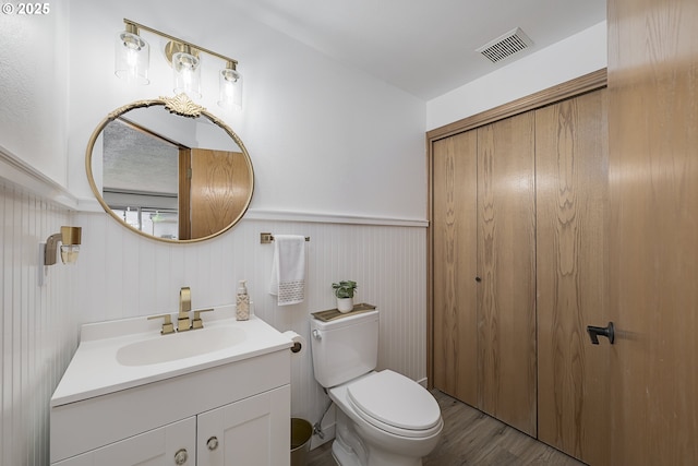 13326 SW Shore Dr, Portland, OR 97223 - half bath with vanity, wood finished floors, and wainscoting