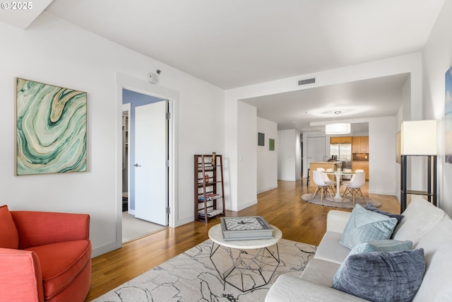 1310 NW Naito Pkwy, Portland, OR 97209 - living area with light wood-style floors and baseboards