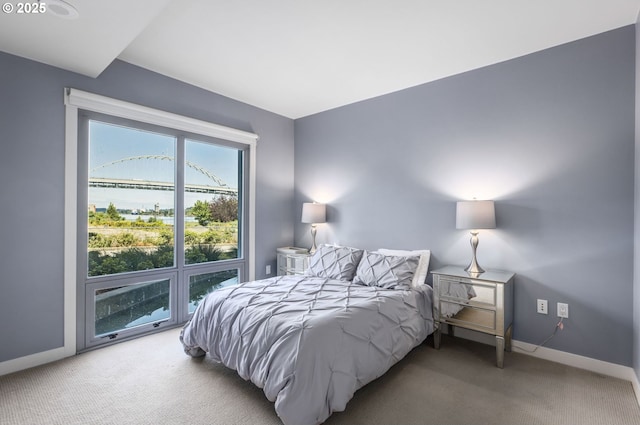 1310 NW Naito Pkwy, Portland, OR 97209 - carpeted bedroom featuring baseboards and a water view