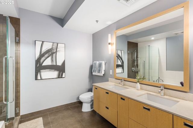 1310 NW Naito Pkwy, Portland, OR 97209 - bathroom with double vanity, a stall shower, and tile patterned floors