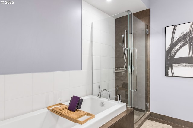1310 NW Naito Pkwy, Portland, OR 97209 - full bath featuring a shower stall, a bath, and tile patterned floors