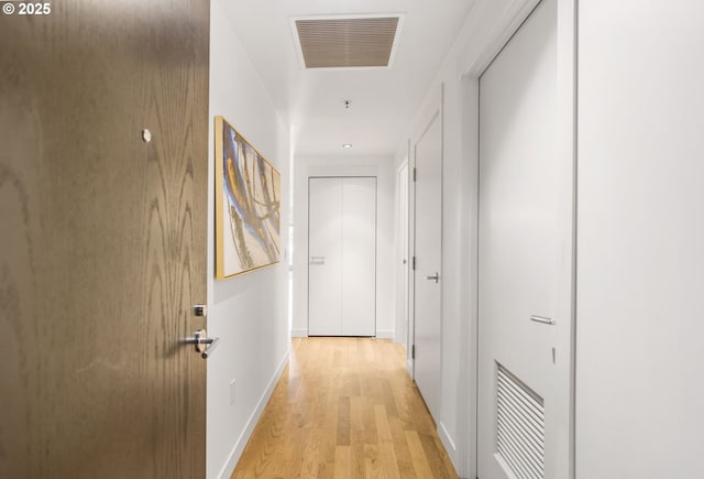 1310 NW Naito Pkwy, Portland, OR 97209 - corridor featuring light wood-type flooring and baseboards