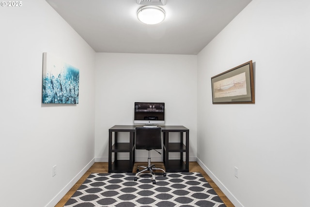 1310 NW Naito Pkwy, Portland, OR 97209 - office area with dark wood-style flooring and heating unit