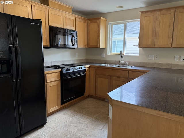 539 NW Blair Loop, Sheridan, OR 97378 - kitchen with black appliances, a sink, and dark countertops