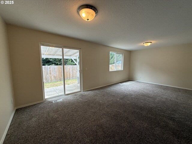 539 NW Blair Loop, Sheridan, OR 97378 - empty room featuring carpet, baseboards, and a textured ceiling