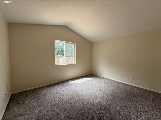 539 NW Blair Loop, Sheridan, OR 97378 - bonus room featuring carpet flooring, lofted ceiling, baseboards, and a textured ceiling