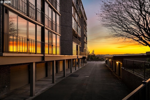 outdoor building at dusk with a garage