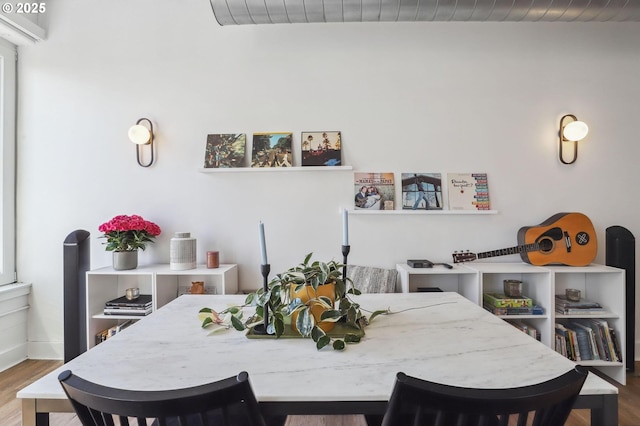 dining area with wood finished floors