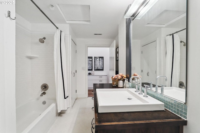 full bathroom featuring vanity, visible vents, and shower / bathtub combination with curtain
