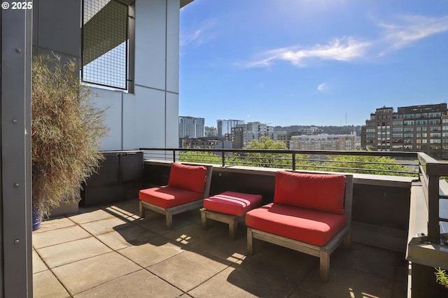 view of patio featuring a city view and a balcony