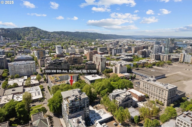 birds eye view of property with a mountain view and a view of city