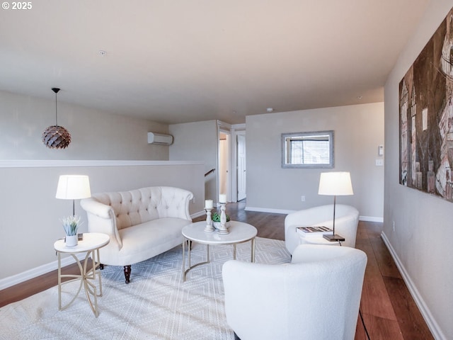 living room with hardwood / wood-style floors and a wall mounted AC