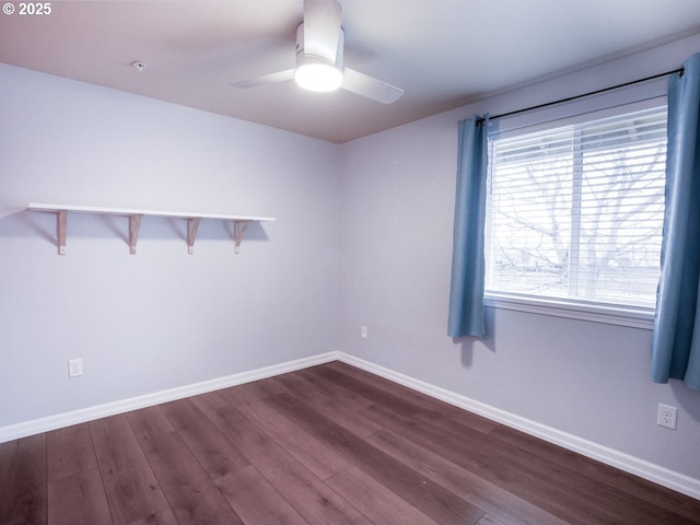 unfurnished room with dark wood-type flooring and ceiling fan