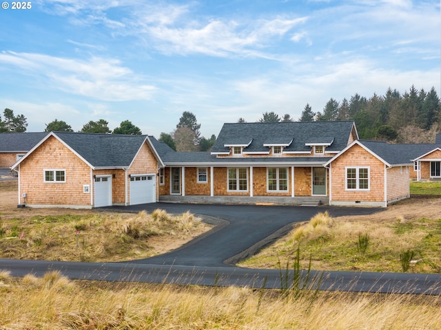 view of front of home with driveway and an attached garage