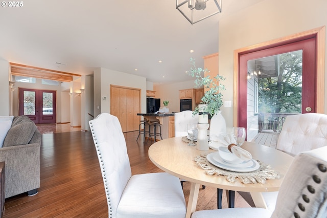 dining area with french doors and hardwood / wood-style flooring