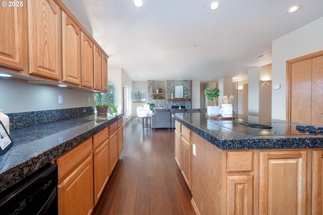 14788 S Burkstrom Rd, Oregon City, OR 97045 - kitchen with black appliances, dark wood-style floors, open floor plan, a fireplace, and recessed lighting