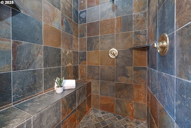 bathroom featuring a tile shower