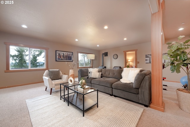 carpeted living room featuring a wood stove