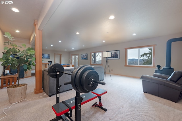 exercise room featuring light colored carpet