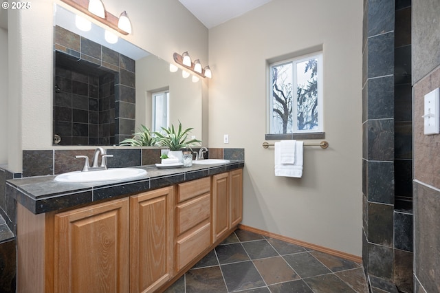 14788 S Burkstrom Rd, Oregon City, OR 97045 - bathroom with plenty of natural light, double vanity, baseboards, and stone finish flooring
