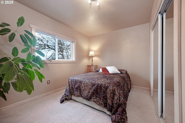 carpeted bedroom featuring a closet