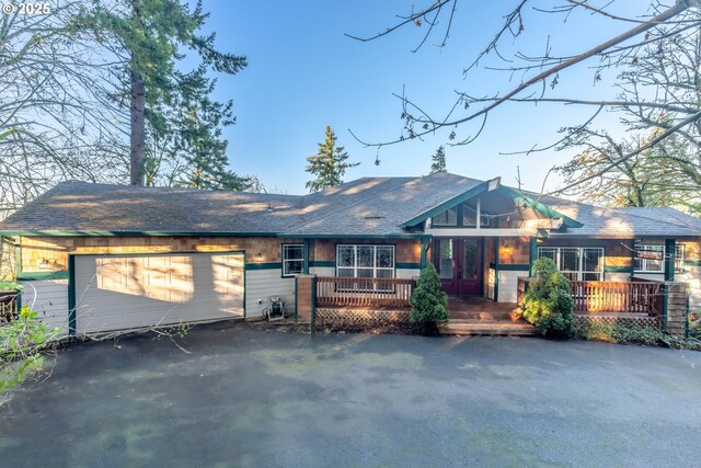 14788 S Burkstrom Rd, Oregon City, OR 97045 - view of front of home with a garage and asphalt driveway