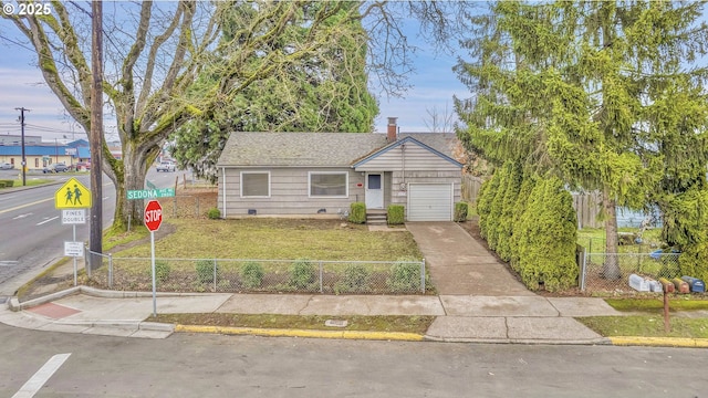 view of front facade with a front yard and a garage