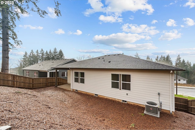 rear view of property with cooling unit