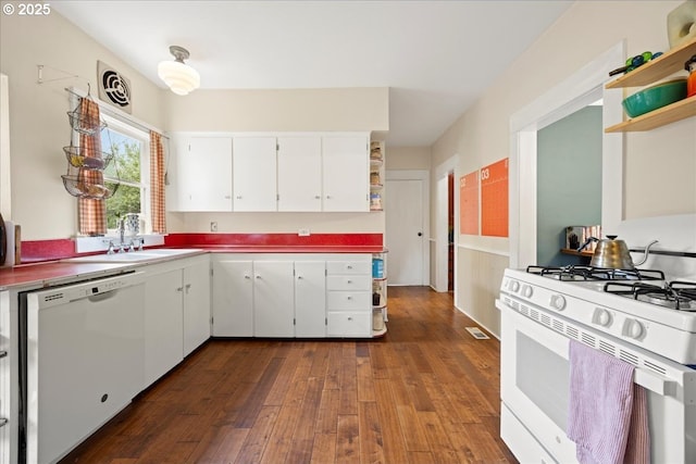 kitchen featuring white cabinetry, sink, white appliances, and dark wood-type flooring