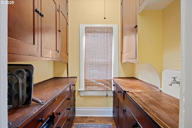 interior space with dark wood-type flooring and butcher block countertops