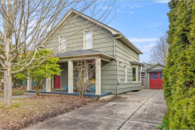 view of front of house featuring a garage and an outdoor structure