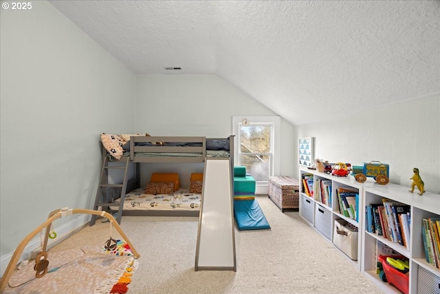 bedroom with lofted ceiling, light colored carpet, and a textured ceiling